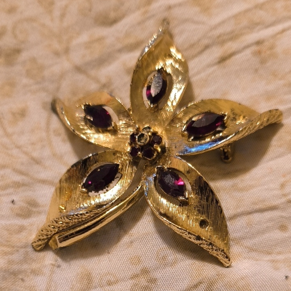 Avon Gold and Purple Star Brooch with Gemstone Accents